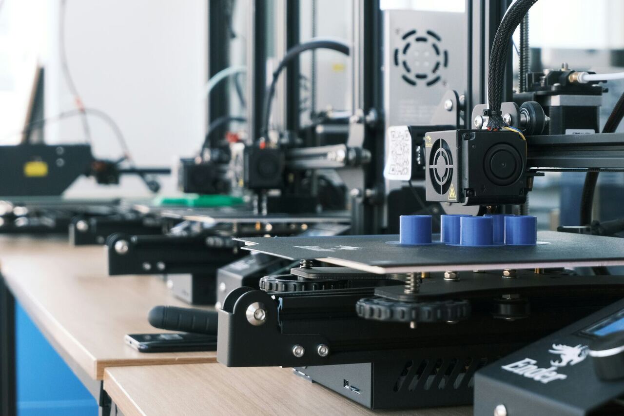 A row of desktop 3D printers on a workbench, representing the MVP Lab prototyping service